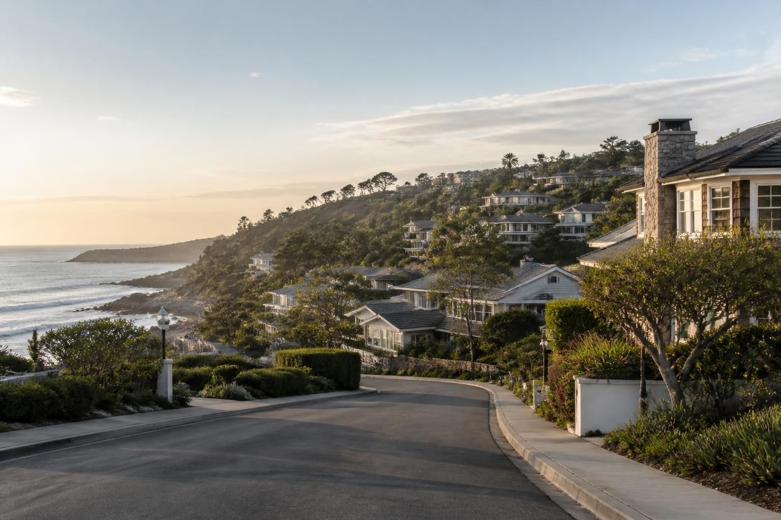 Hillside homes near the coast on a quiet street.